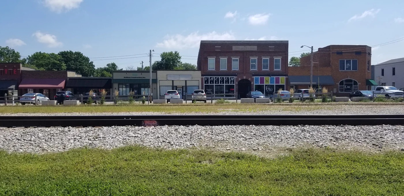 Downtown Bargersville storefronts viewed across railroad tracks